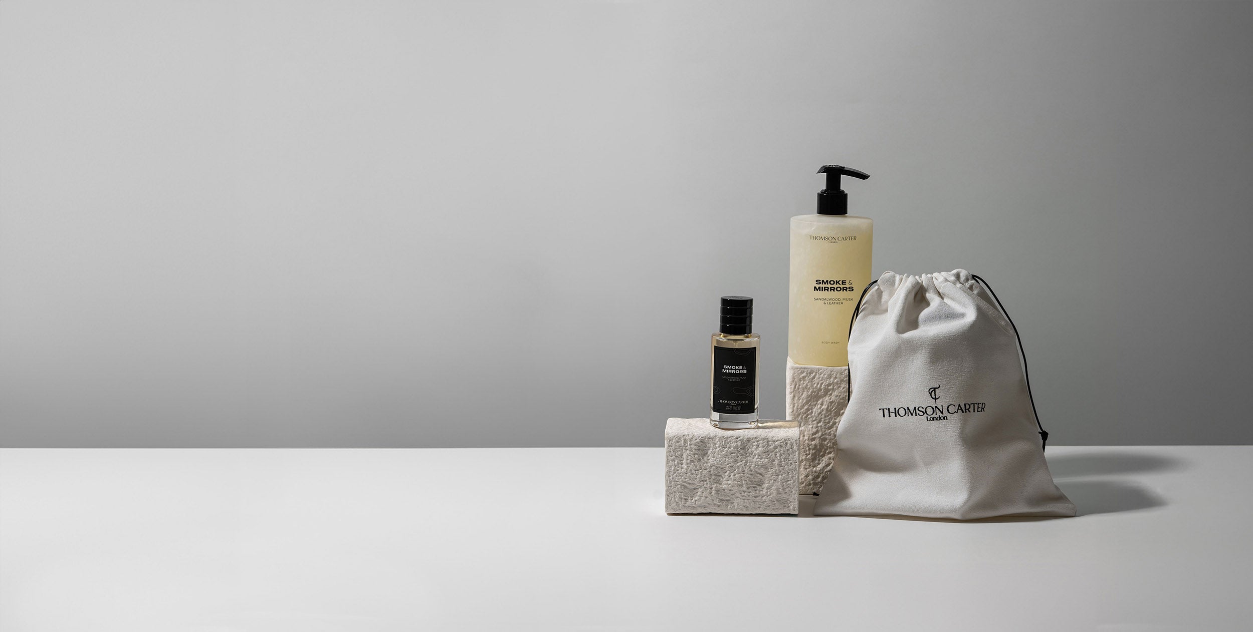 Smoke and Mirrors eau de parfum, body wash, and pouch